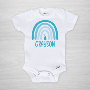 This Easter onesie features your little one's name and a modern blue boho Easter rainbow with a bunny., short sleeved
