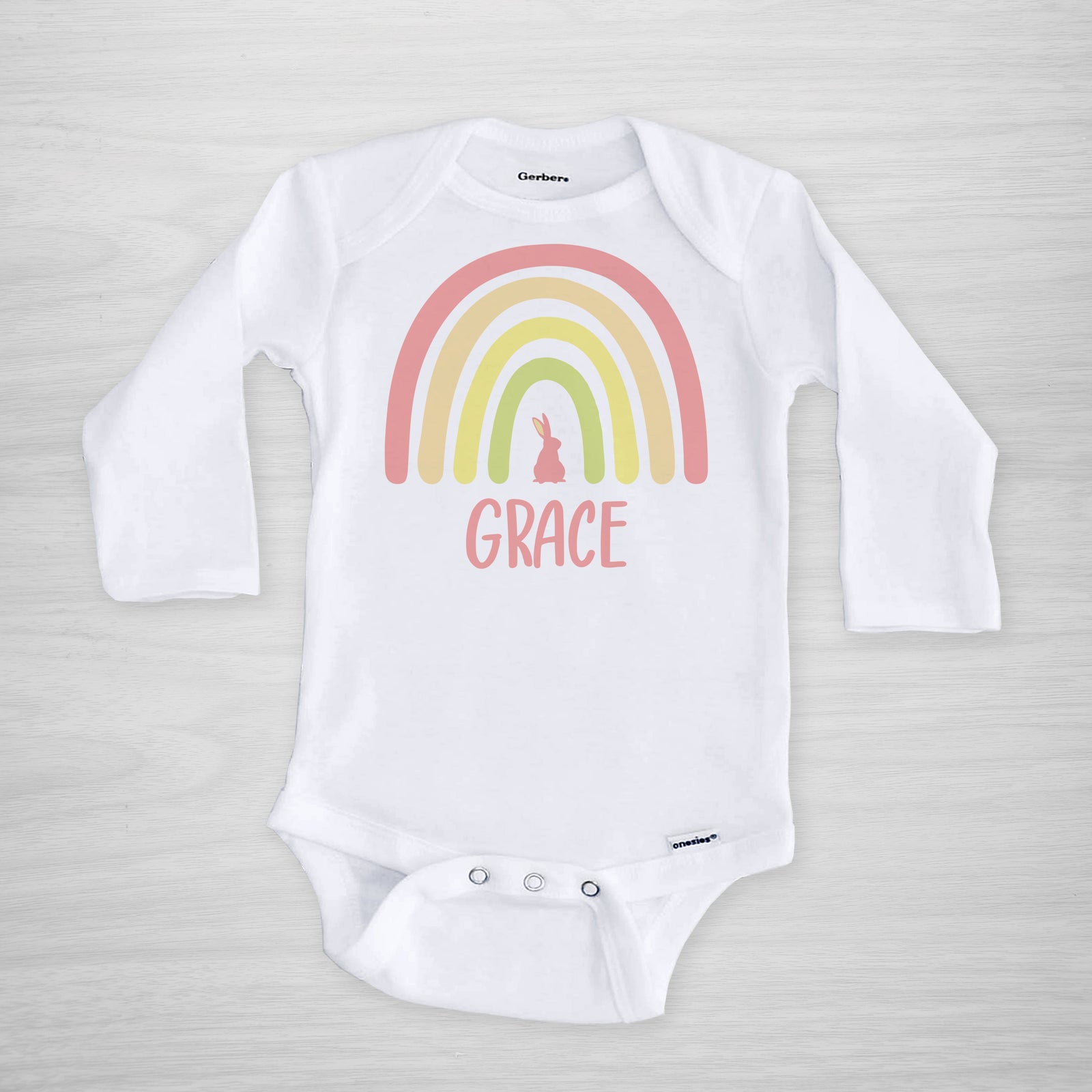 Personalized Easter Onesie, featuring a boho Easter rainbow with a bunny, pink, short sleeved