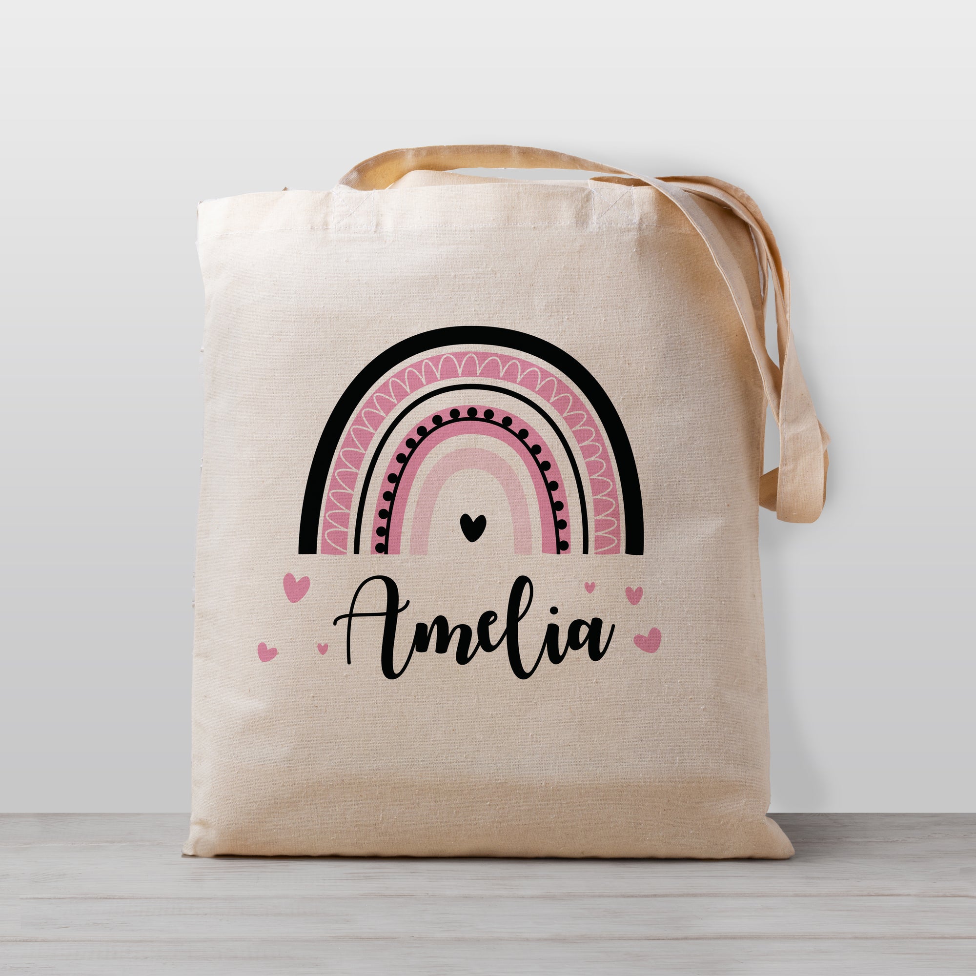 Personalized kid tote bag, with a pink and black rainbow. Totes are lightweight and easy for your child to carry to daycare, preschool, or even a trip to Grandma's house