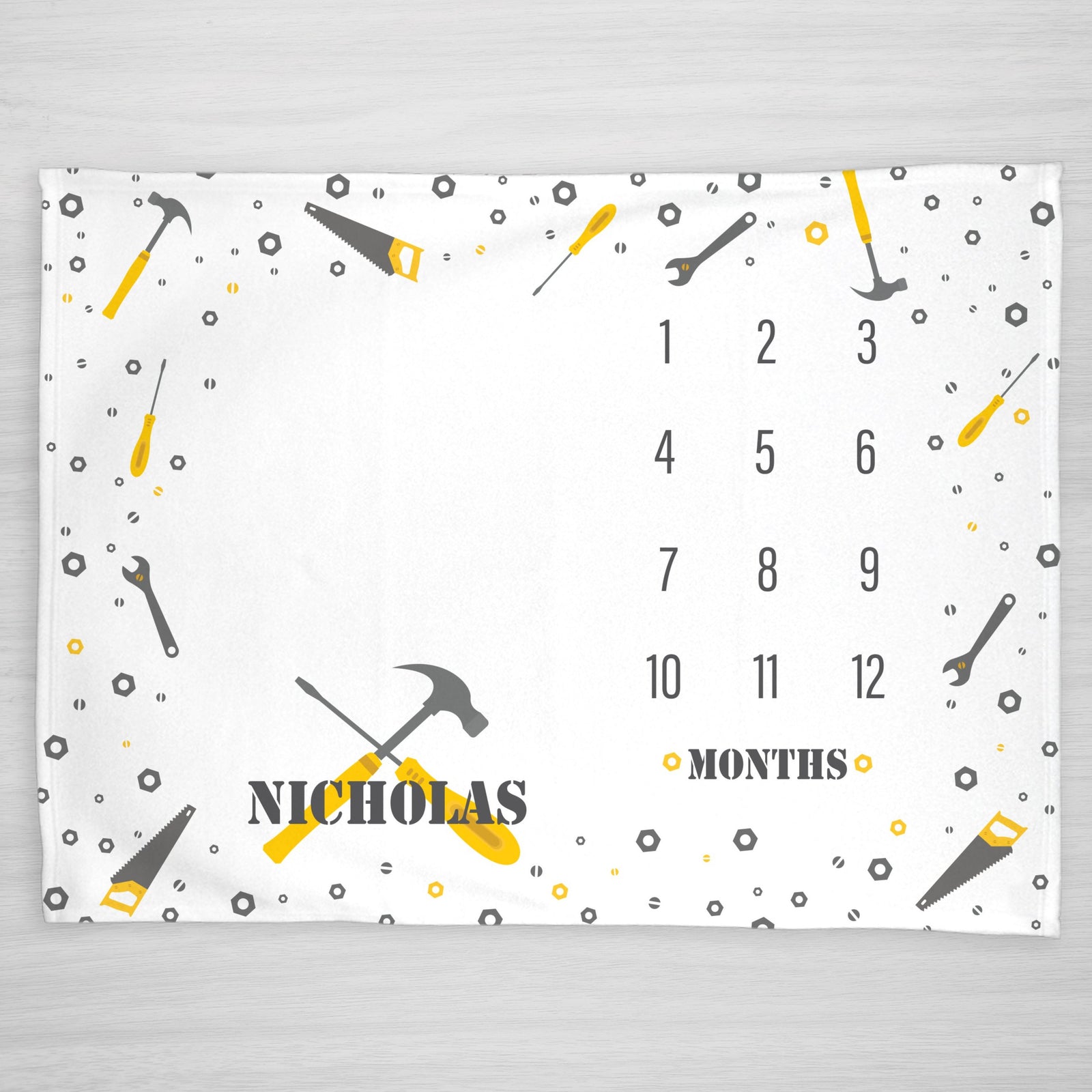 Tools Milestone Blanket. Featuring hammer, screwdriver, saw, wrench and lots of screws and bolts. Personalized with baby's name. Colors can be customized to match your nursery