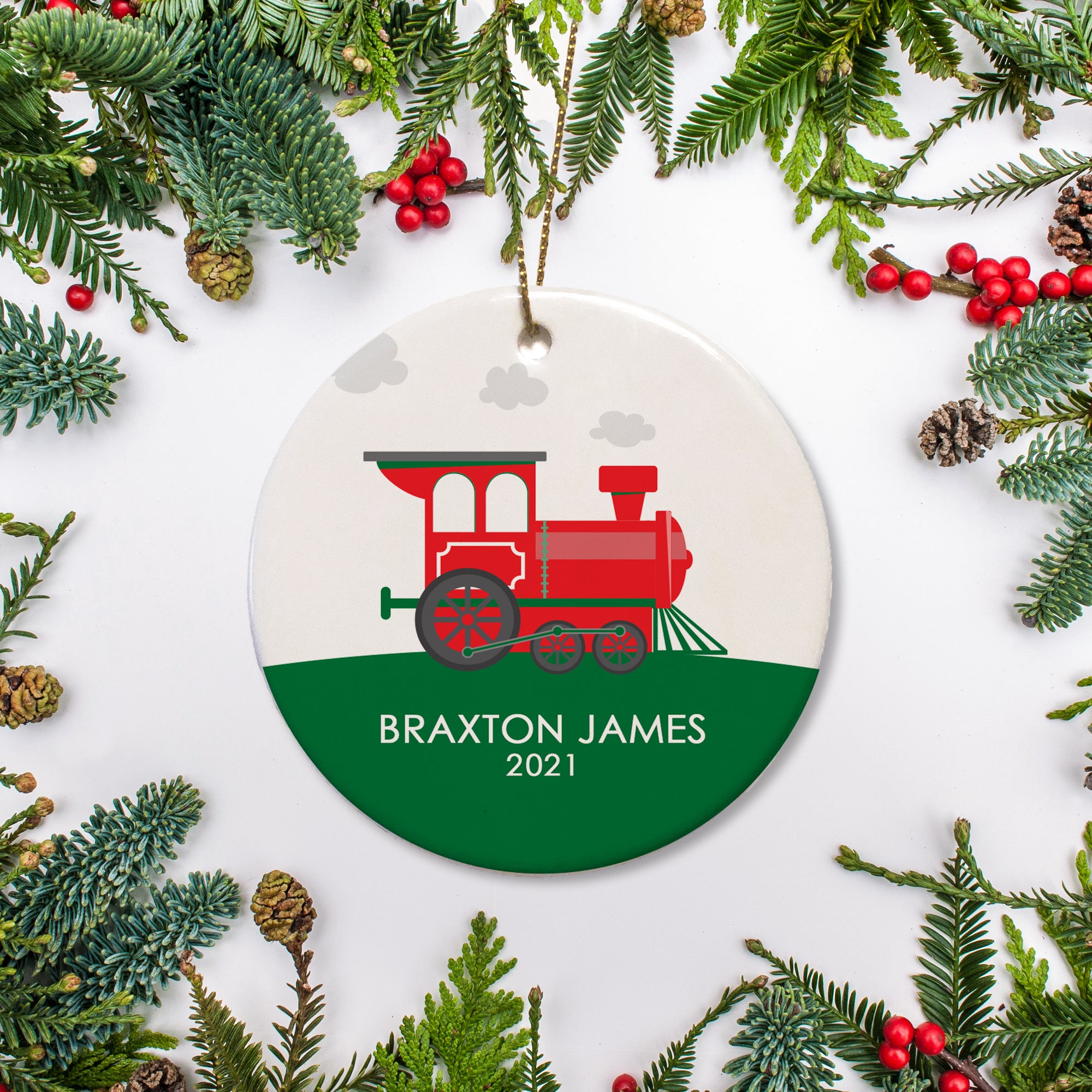Choo Choo Train Keepsake Personalized Christmas Ornament. Red and green train on a green hill. Name and year of your choice in white against the green back ground.| Pipsy.com