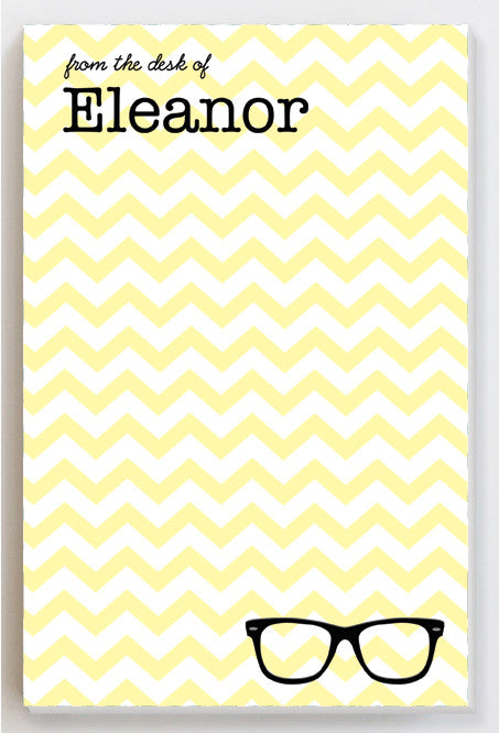 Glasses on a yellow chevron notepad