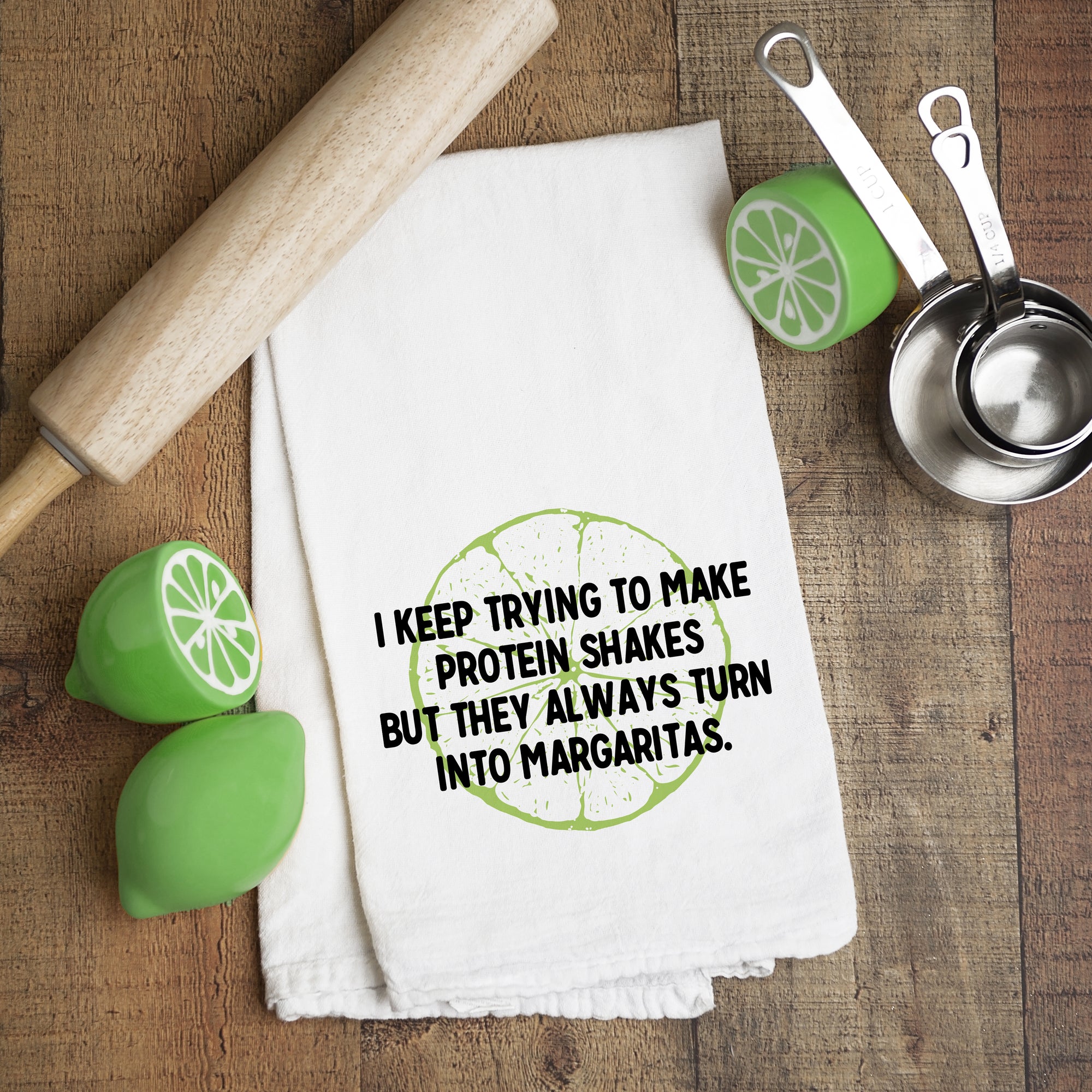 "I keep trying to make protein shakes, but they always turn into margaritas" tea towel, Pipsy.com