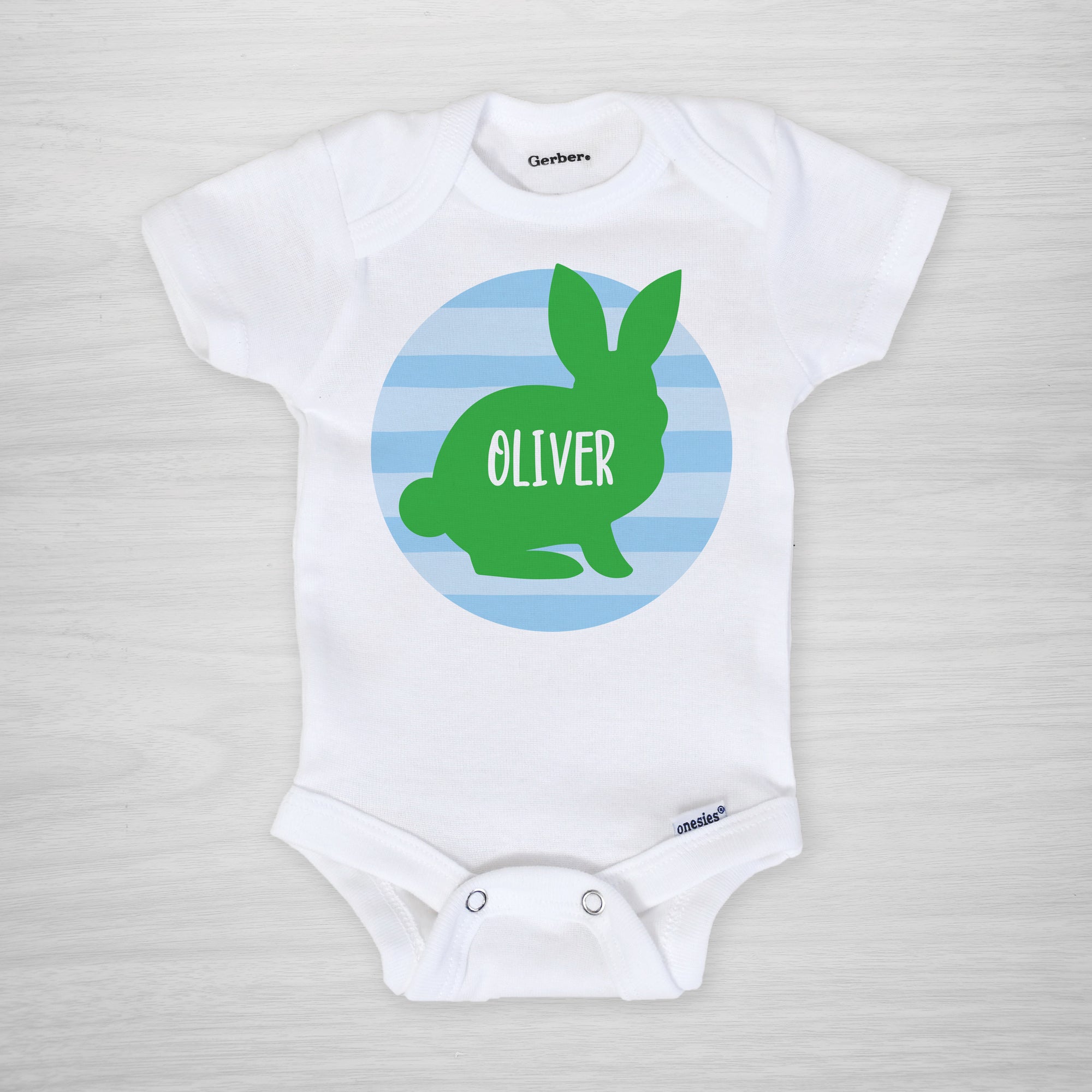 Personalized Easter Onesie, featuring a bunny silhouette on a blue striped circle, short sleeved
