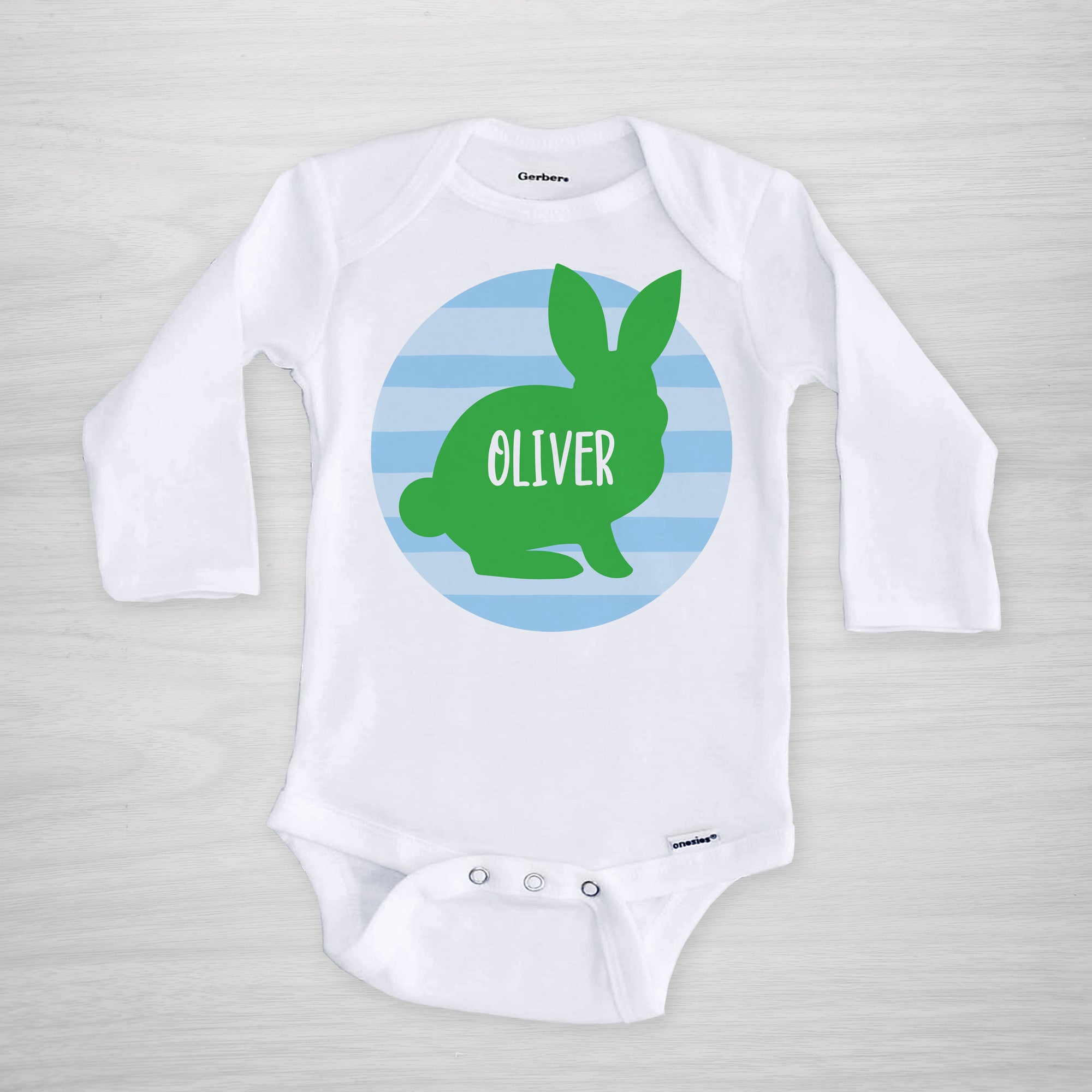 Personalized Easter Onesie, featuring a bunny silhouette on a blue striped circle, long sleeved