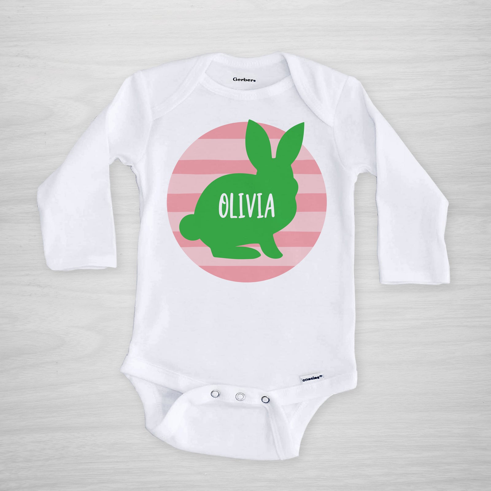 Personalized Easter Onesie, featuring a bunny silhouette on a pink striped circle, short sleeved