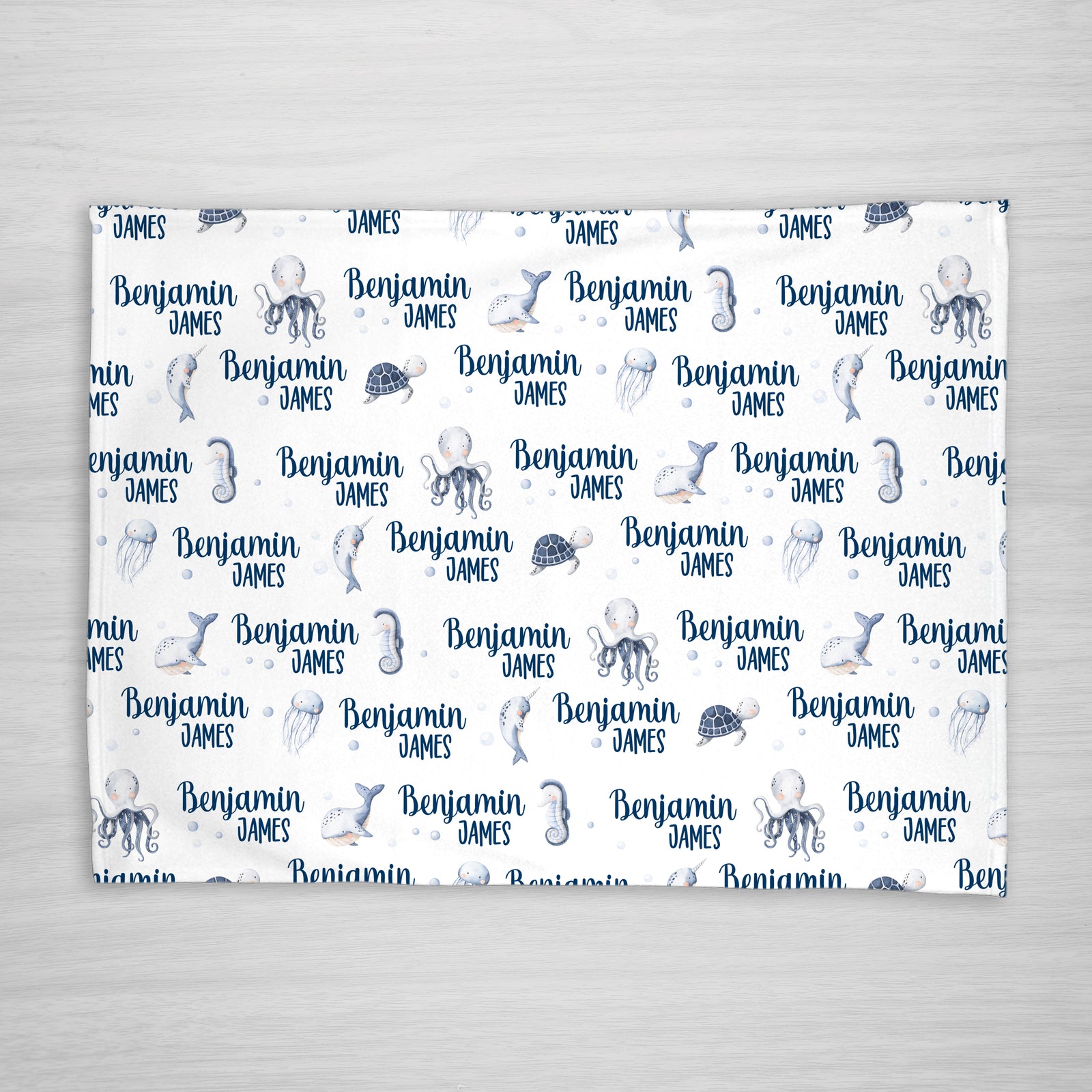 Under the Sea Baby Name Blanket iwth an octopus, whale, narwhal, sea turtle and jellyfish, Pipsy.com