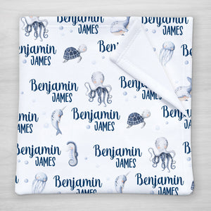 Under the Sea Baby Name Blanket iwth an octopus, whale, narwhal, sea turtle and jellyfish, Pipsy.com